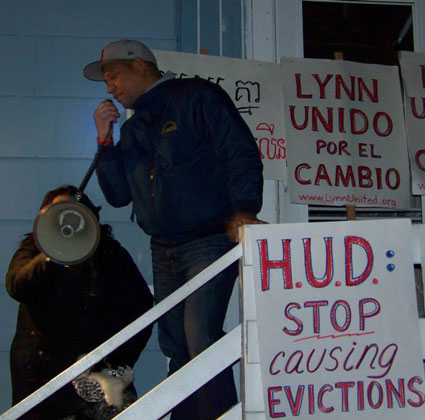 protesters with signs Stop HUD Evictions